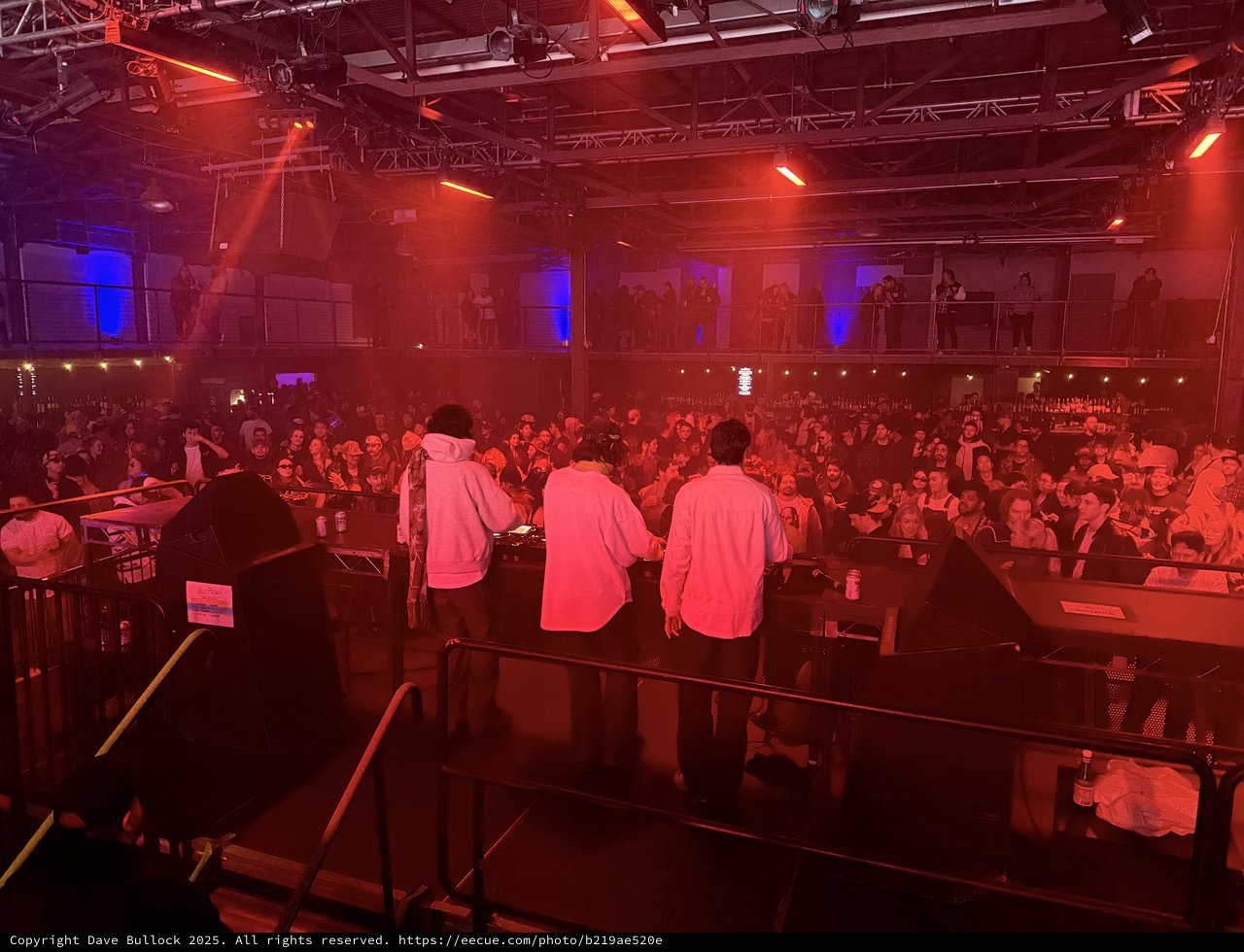 Electronic Music Concert Performance with Dramatic Red Stage Lighting