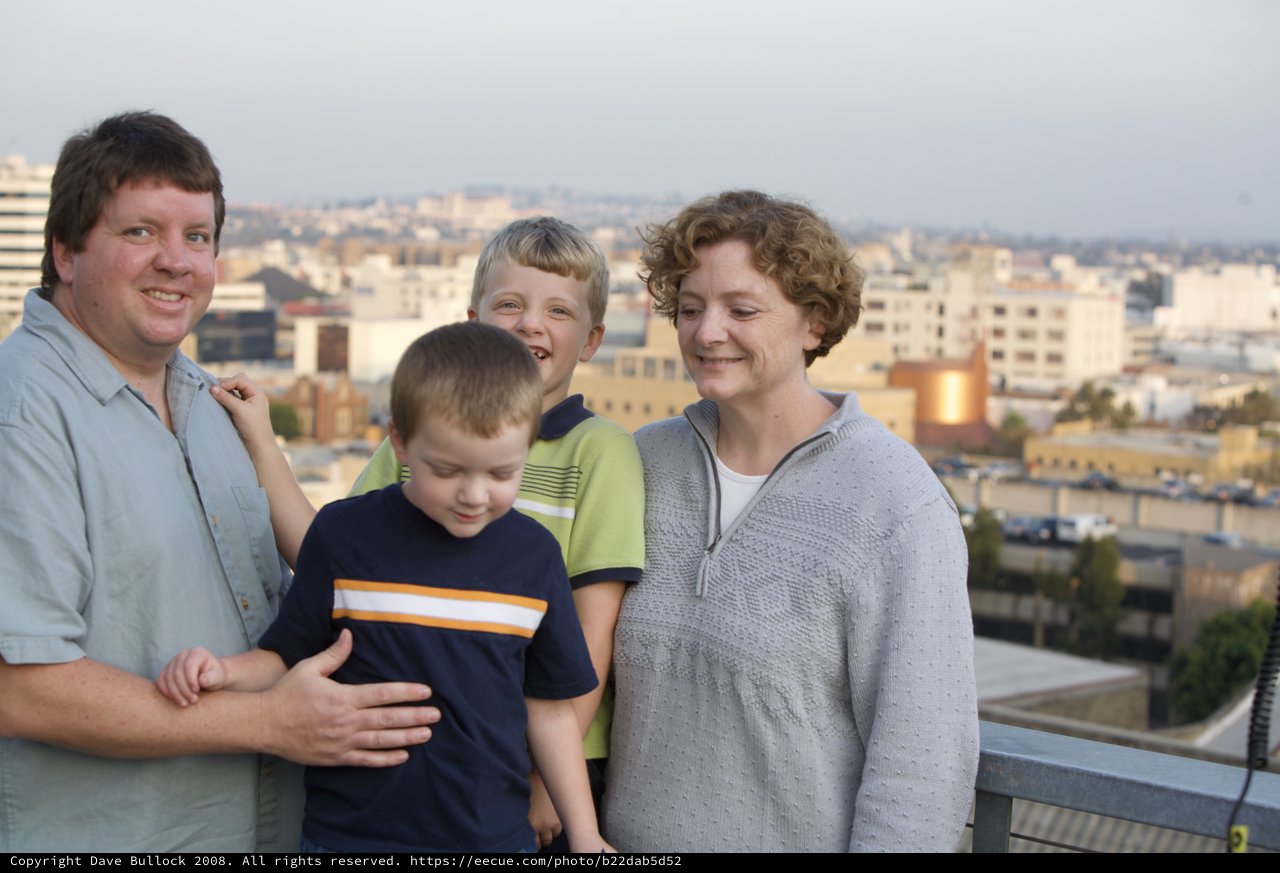Family Portrait on Urban Rooftop at Dusk
