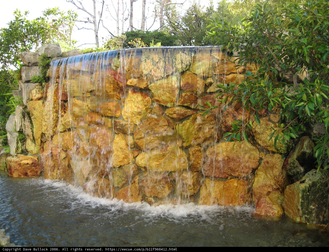 Cascading Waterfall Amidst Lush Foliage