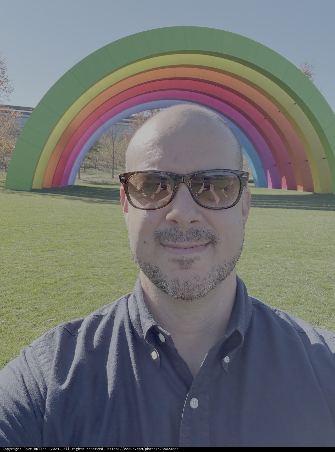 Man Takes Selfie at Colorful Rainbow Art Installation