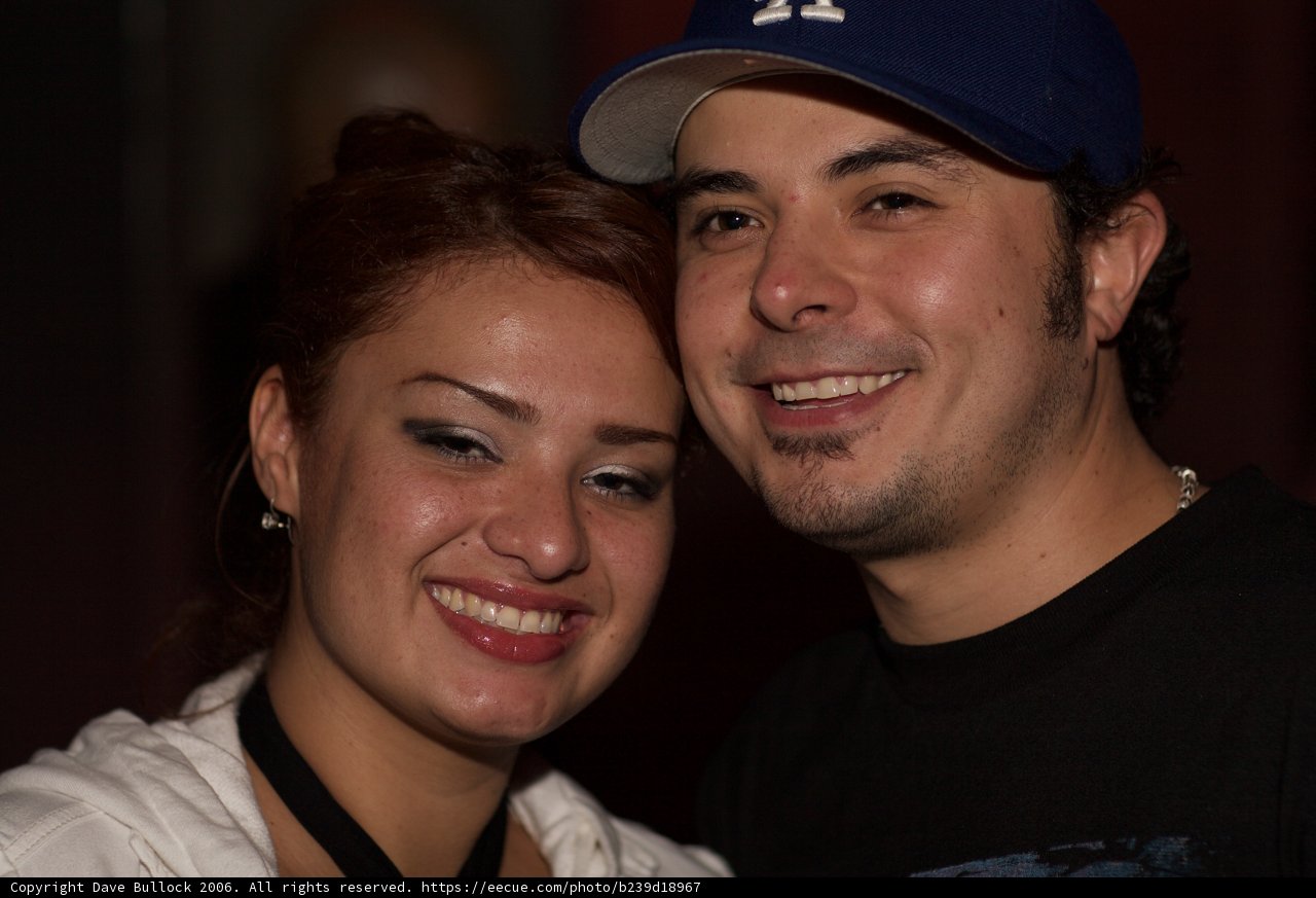 Smiling Couple in Baseball Caps