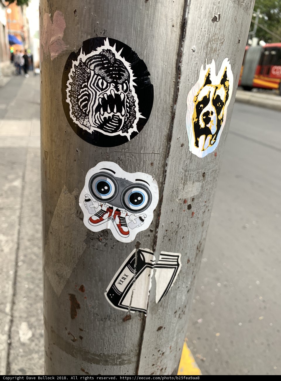 Sticker-Covered Pole on the Street