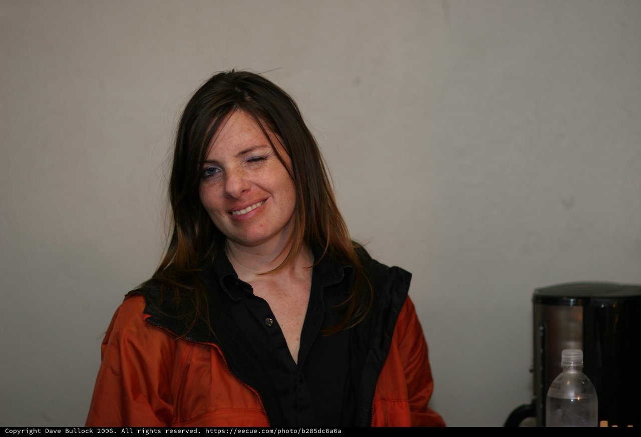 Candid Portrait of Smiling Woman in Orange Jacket