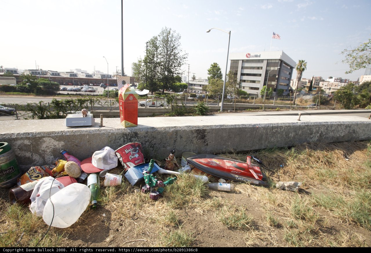 Trash and Motorcycle on the Side of the Road