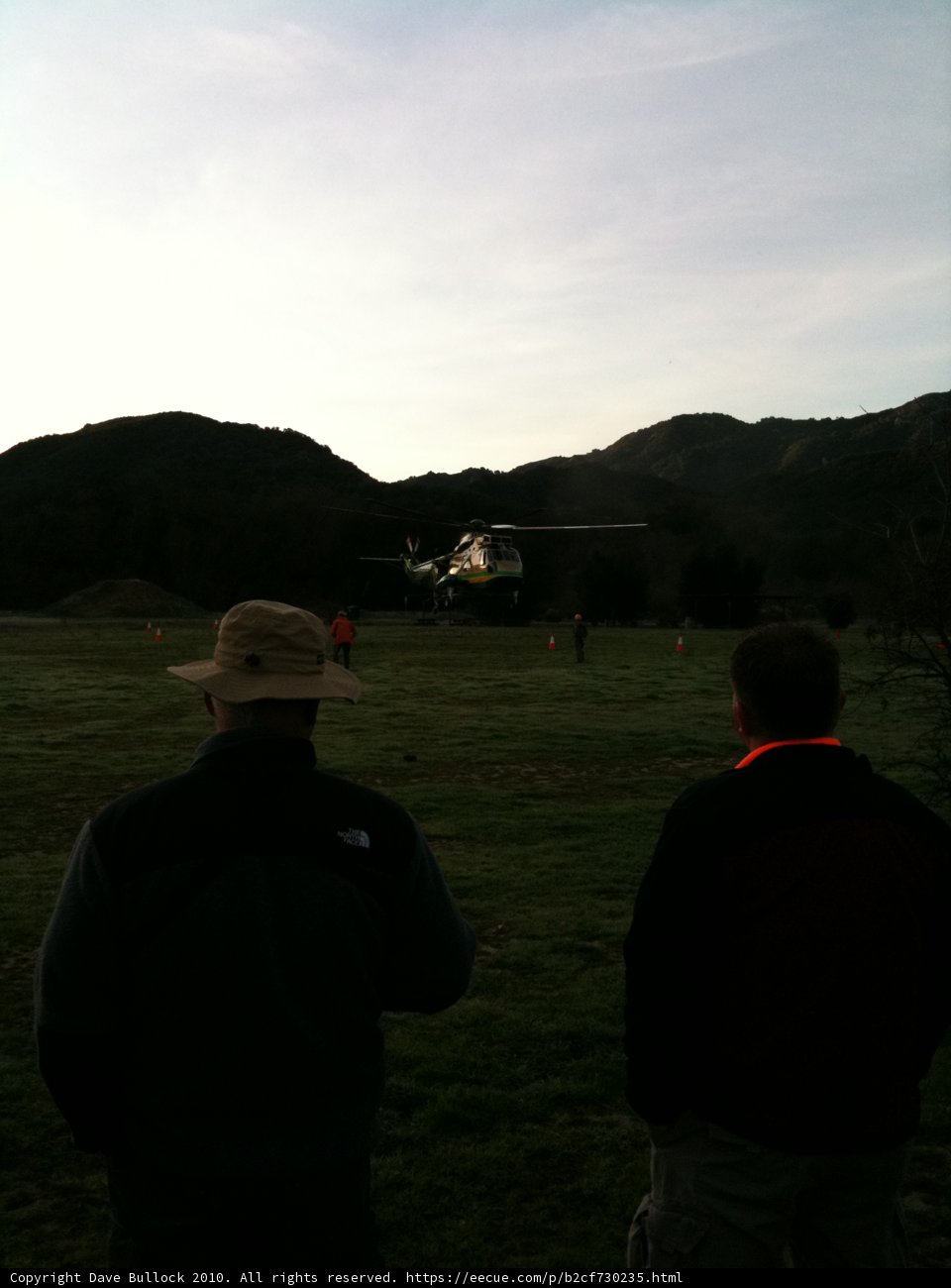 Helicopter take-off from a grassy field
