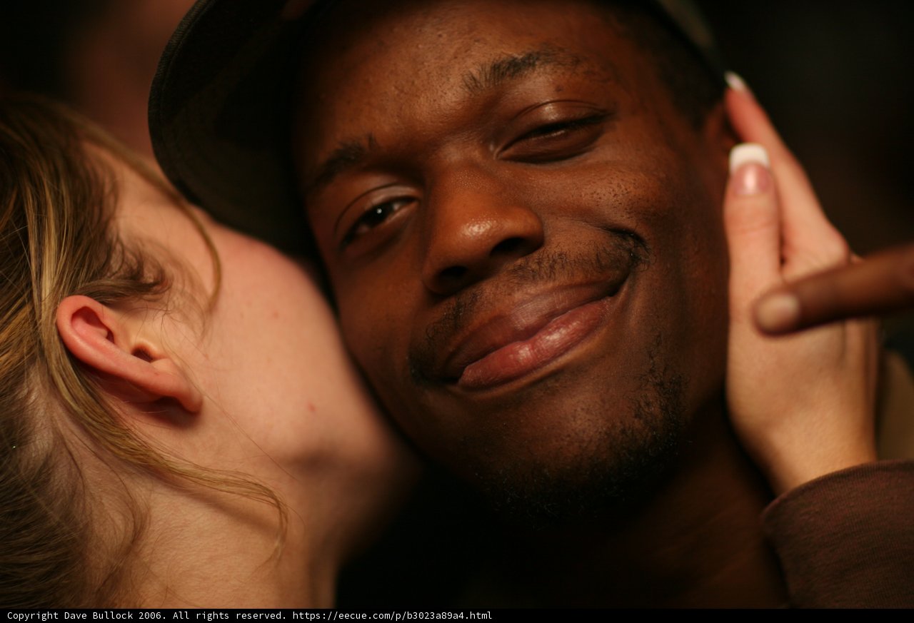 A Romantic Kiss Under a Baseball Hat