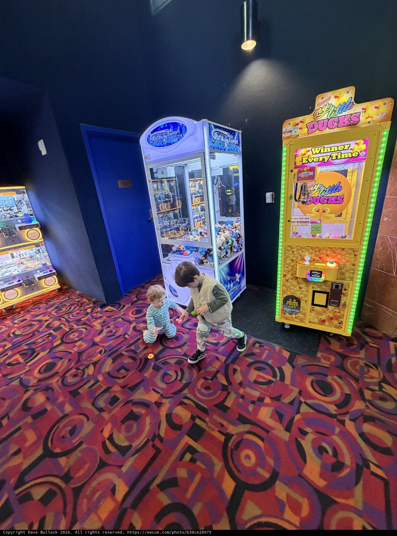 Children Playing at Arcade Game Machines