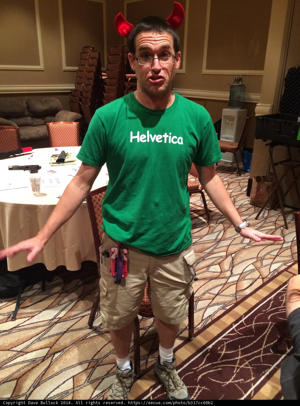 Portrait of Tacitus N in Green T-Shirt at Dining Table