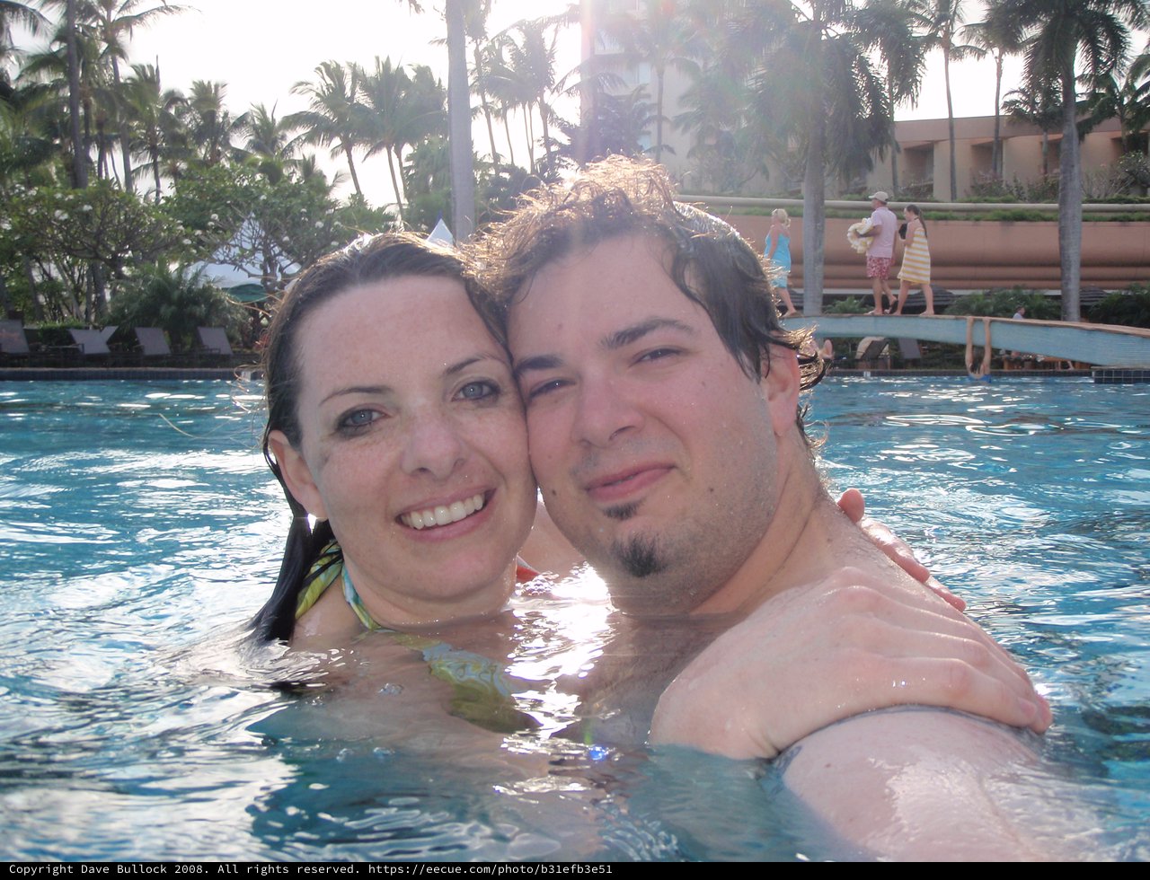 Couple's Romantic Pool Moment in Hawaii Resort