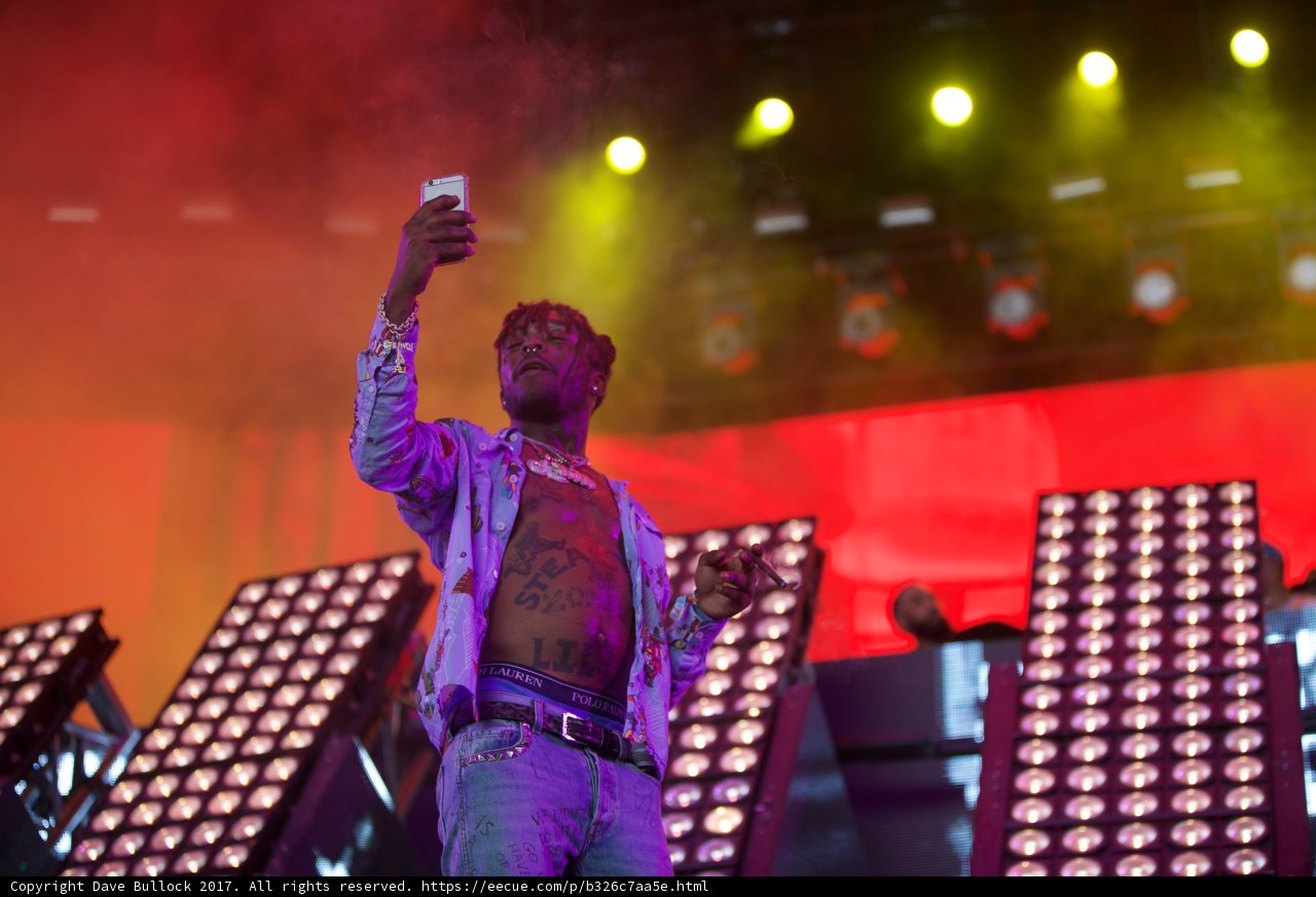 Lil Uzi Vert on Stage with a Phone in Hand