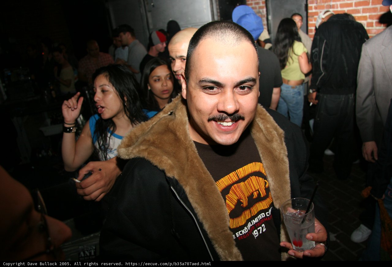 Mustache and Bearded Man at Urban Party