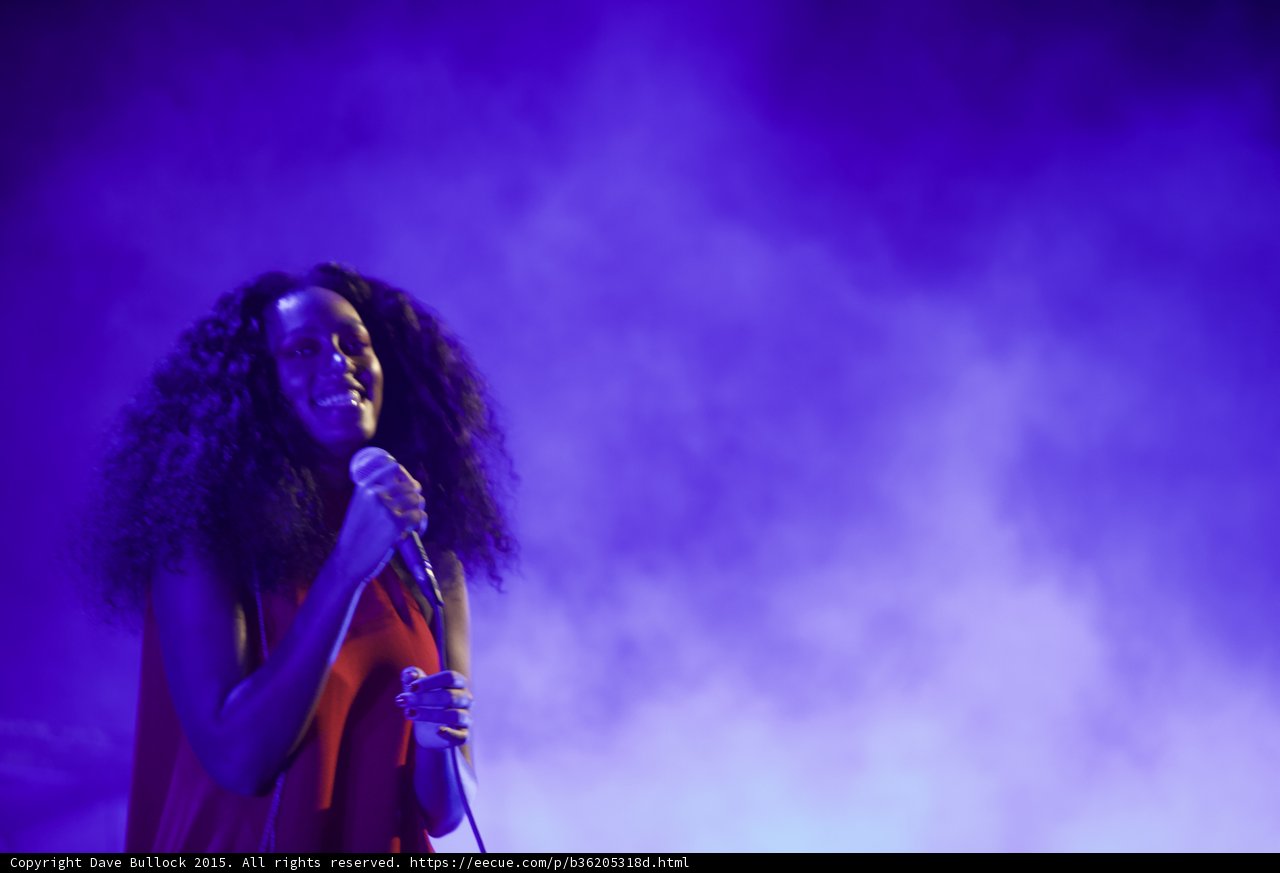 Solange Portrait Smiling Wild Hair Holding Microphone Purple