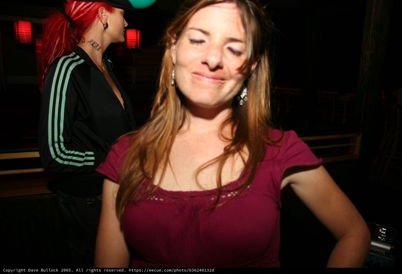 Woman Smiling at Nightclub Party in 2005