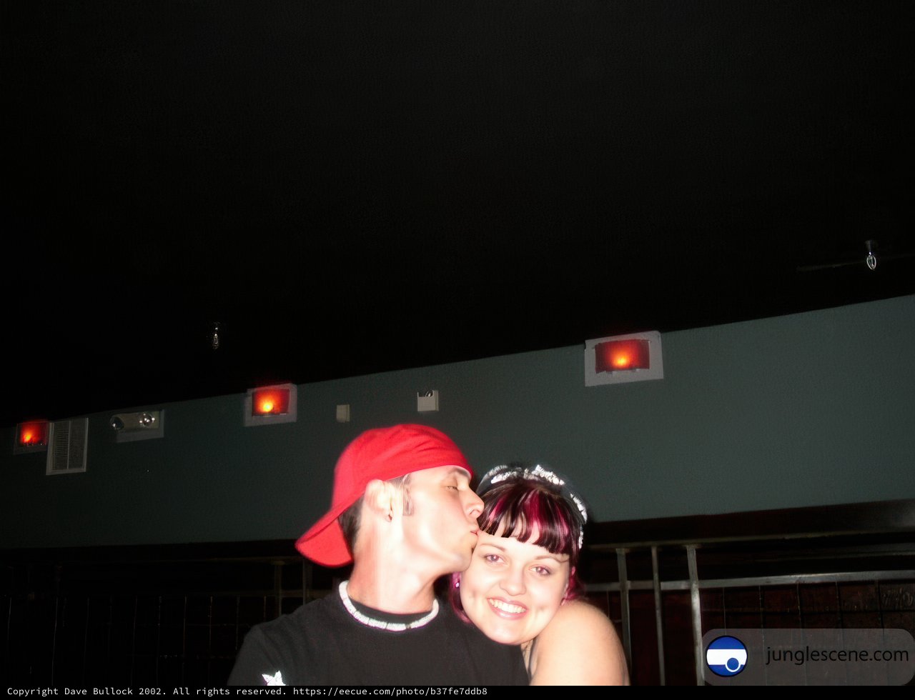 Romantic Kiss under the Red Light