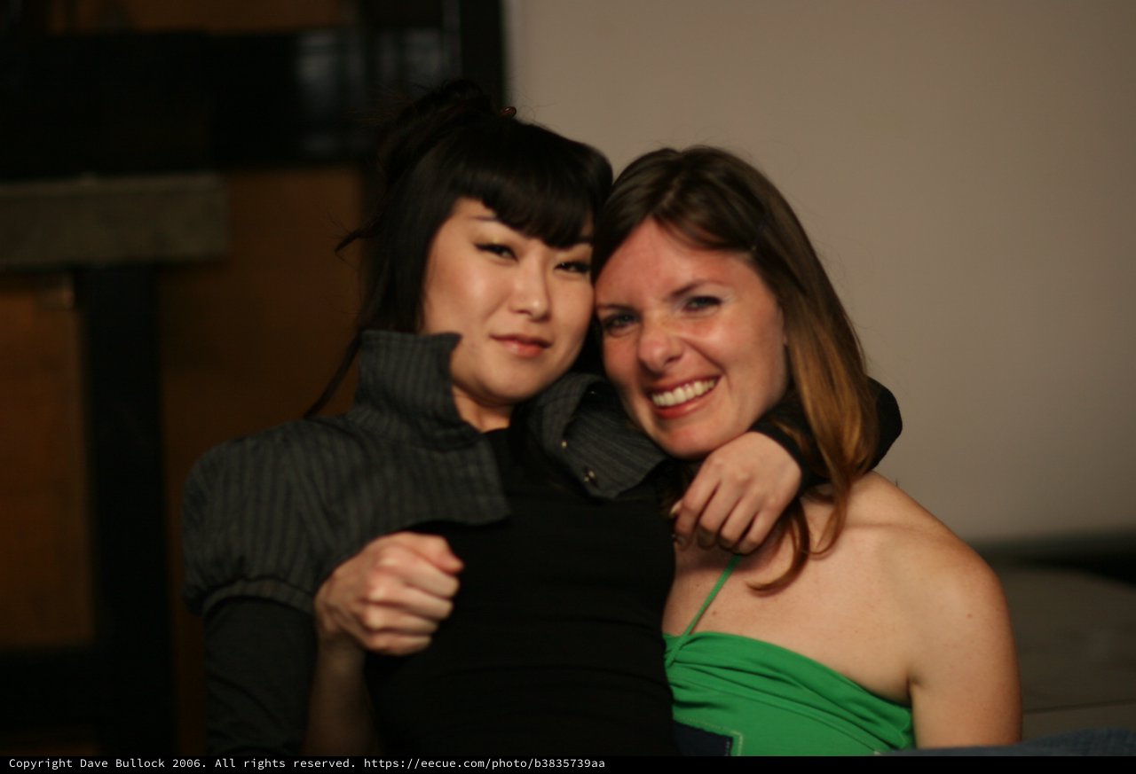 Two Friends Share a Warm Embrace at Party