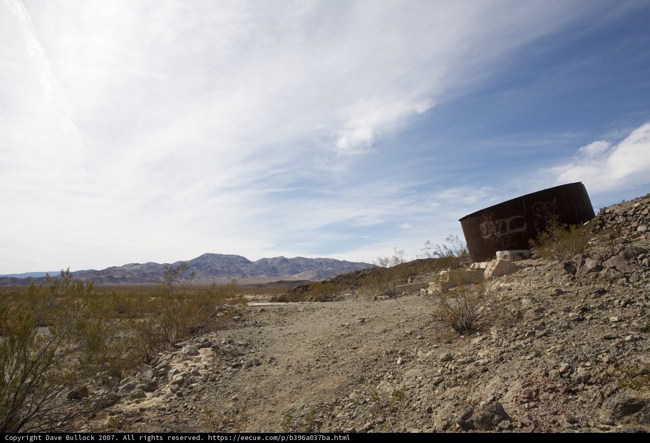 The Abandoned Water Tank on a Dirt Road