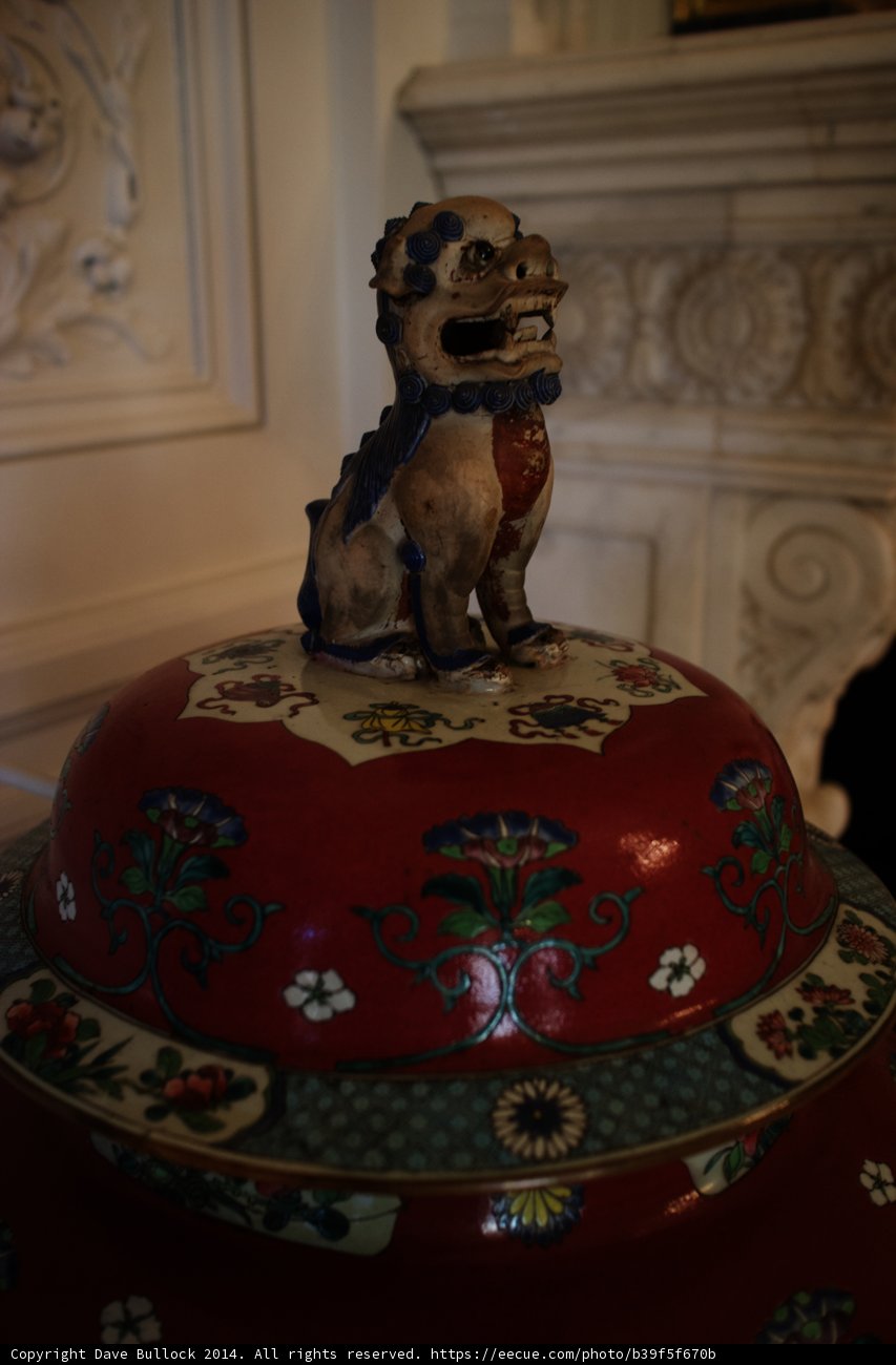 Artistic Red and White Porcelain Vase with Lion Figurine