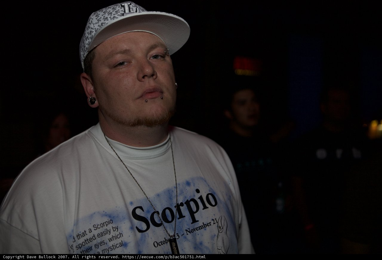 Man in White Shirt and Cap