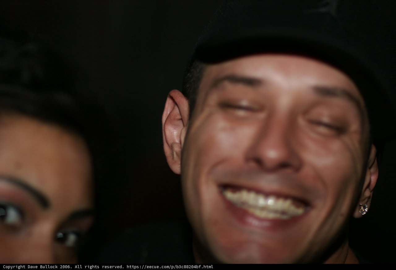 Smiling Man in Baseball Cap