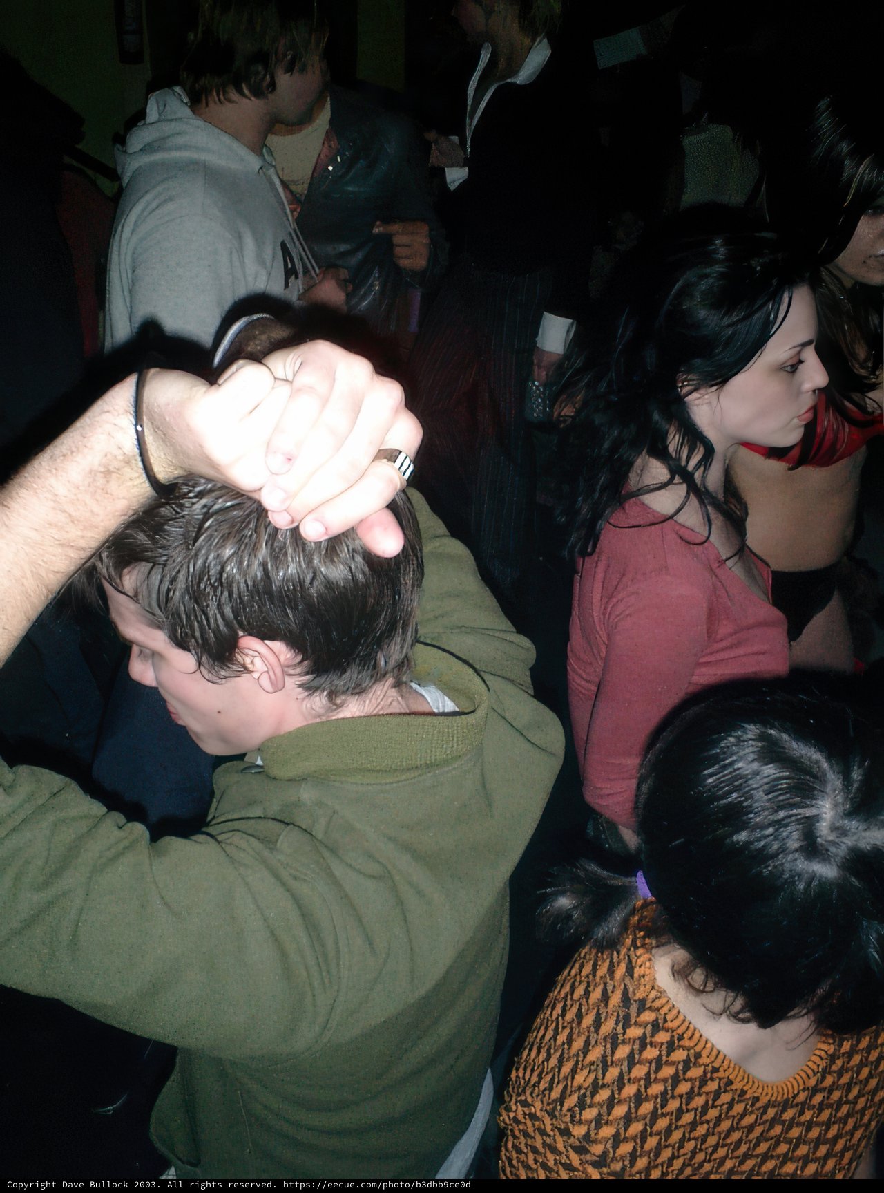 Partygoer Hold Up Hand in Nightclub