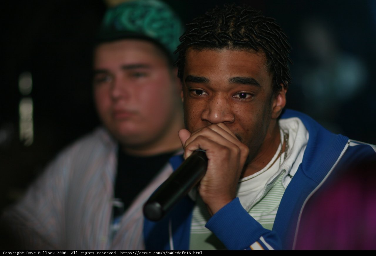 Dreadlocked Artist Holds Mic