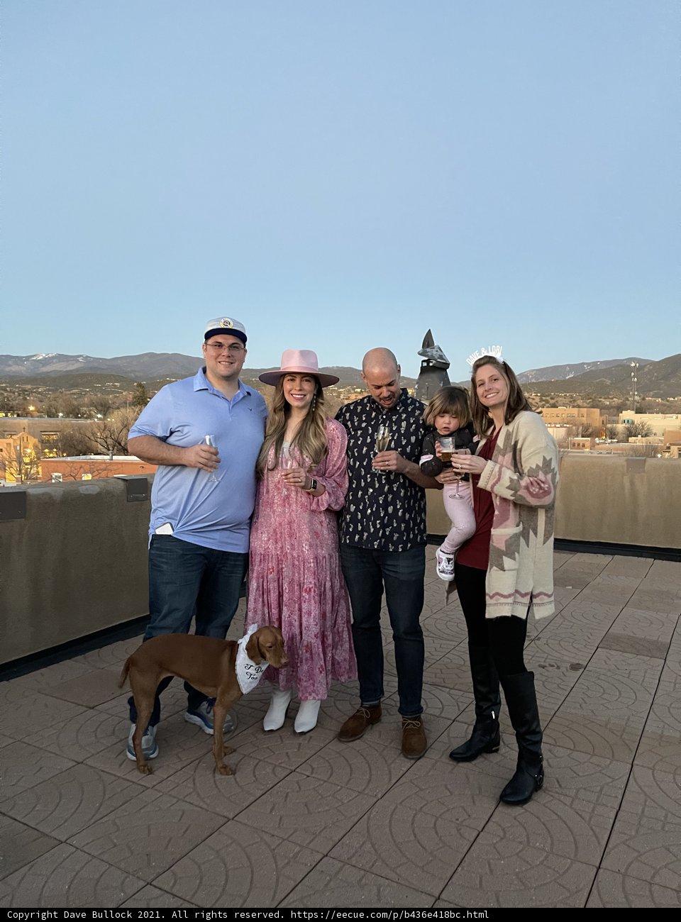 Family Photo with Furry Friend on Rooftop