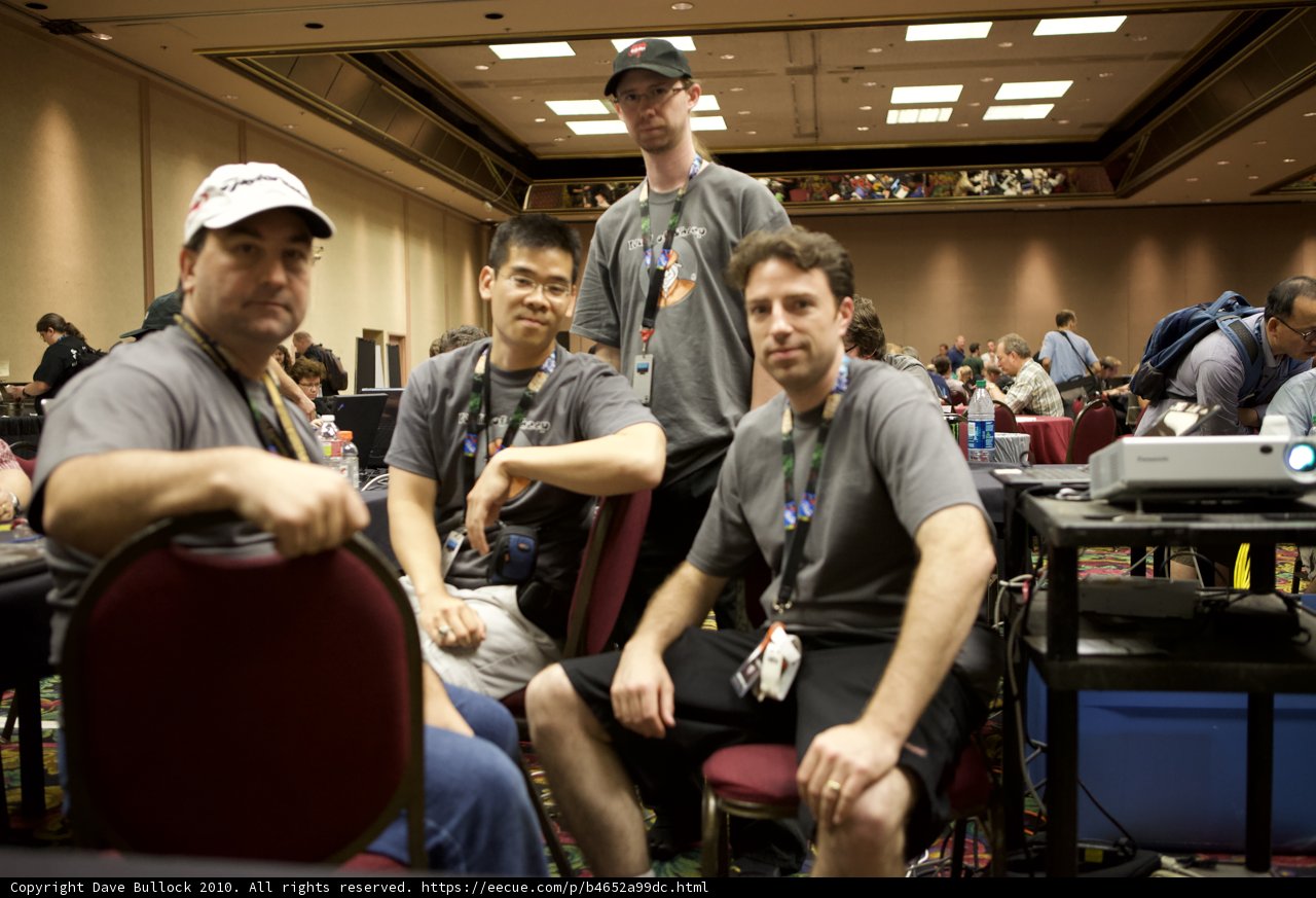 Four Men Sitting on Chairs