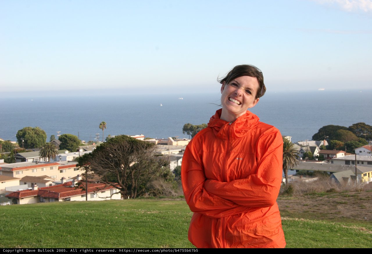 Smiling Woman Overlooking Coastal California Town