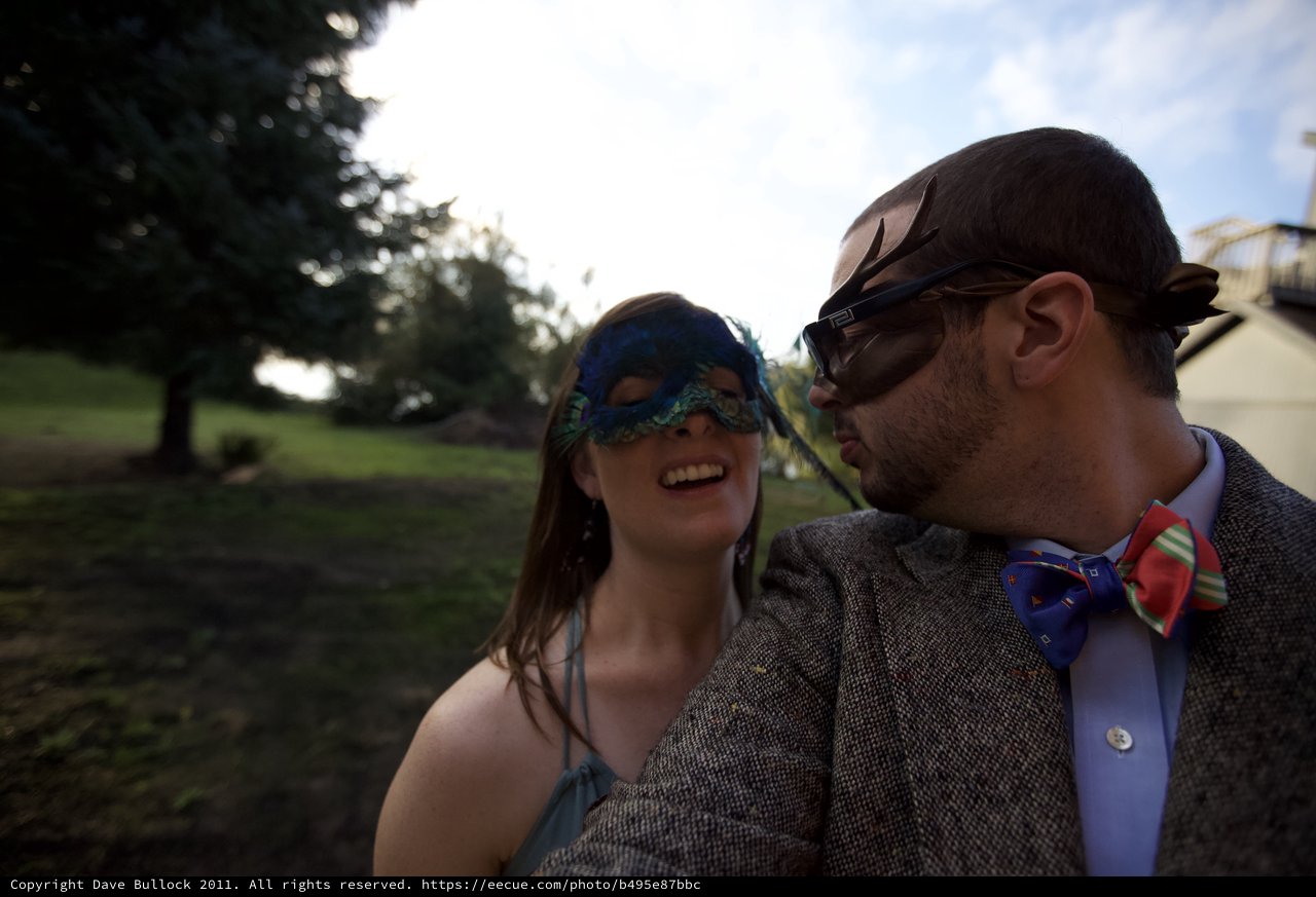 Masked Couple Reveling at Whimsical Masquerade Wedding