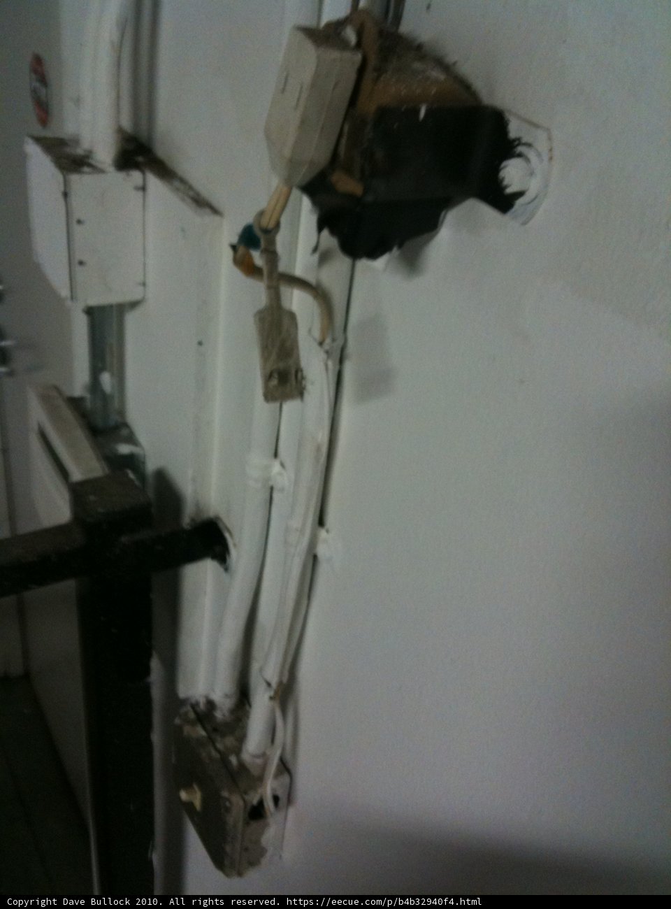 White Outlet and Black Cord