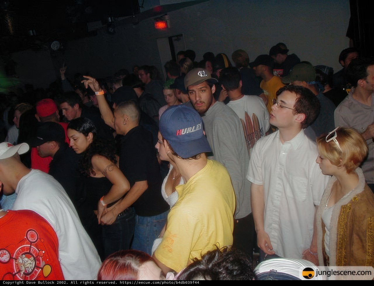 One Man in a Hat Stands Out in the Crowd