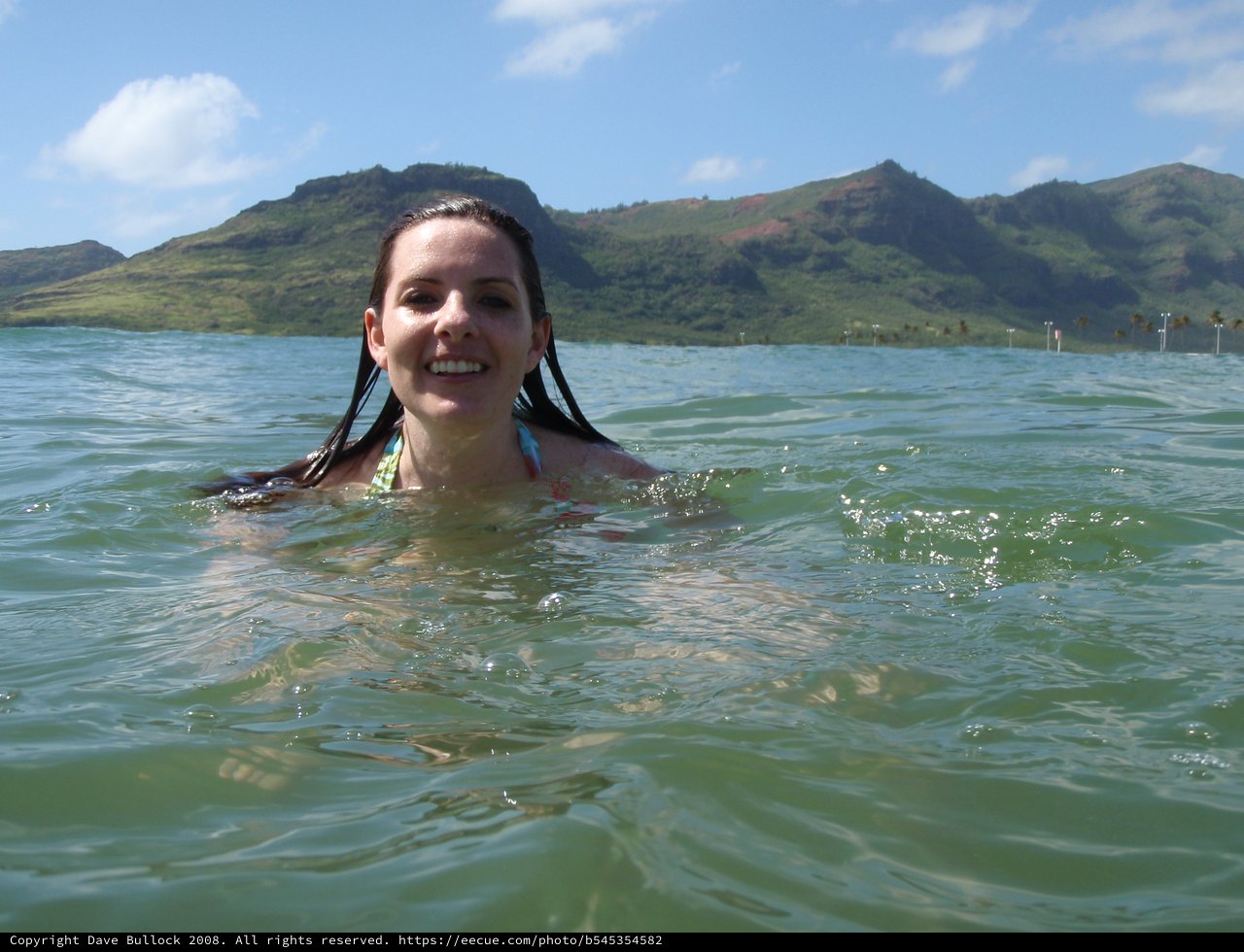 Smiling Woman Swimming in Hawaiian Ocean Waters
