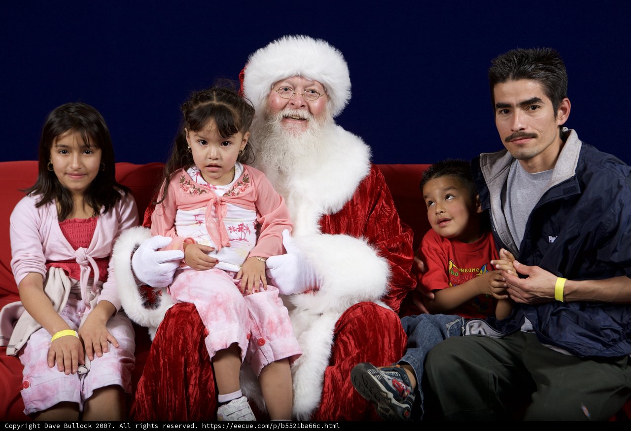 Santa Claus spreading holiday cheer with children