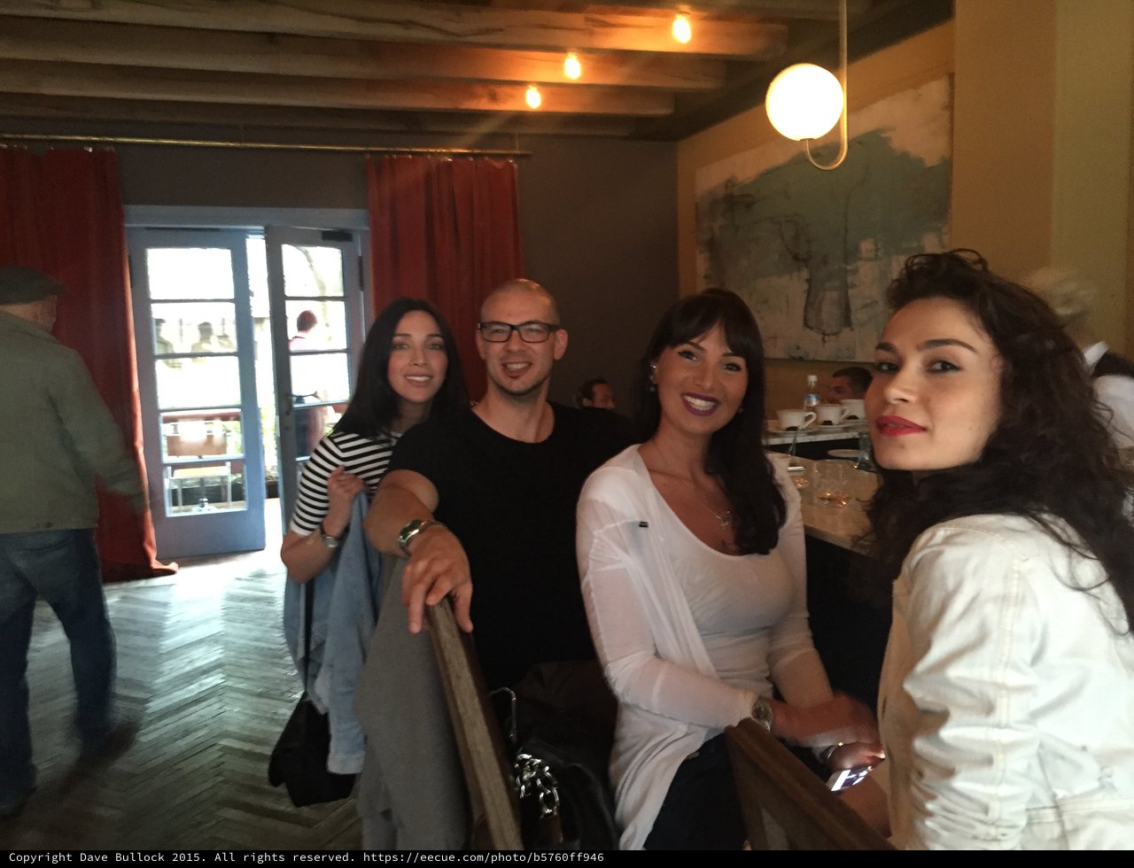 Friends Gathering at a Rustic European Restaurant