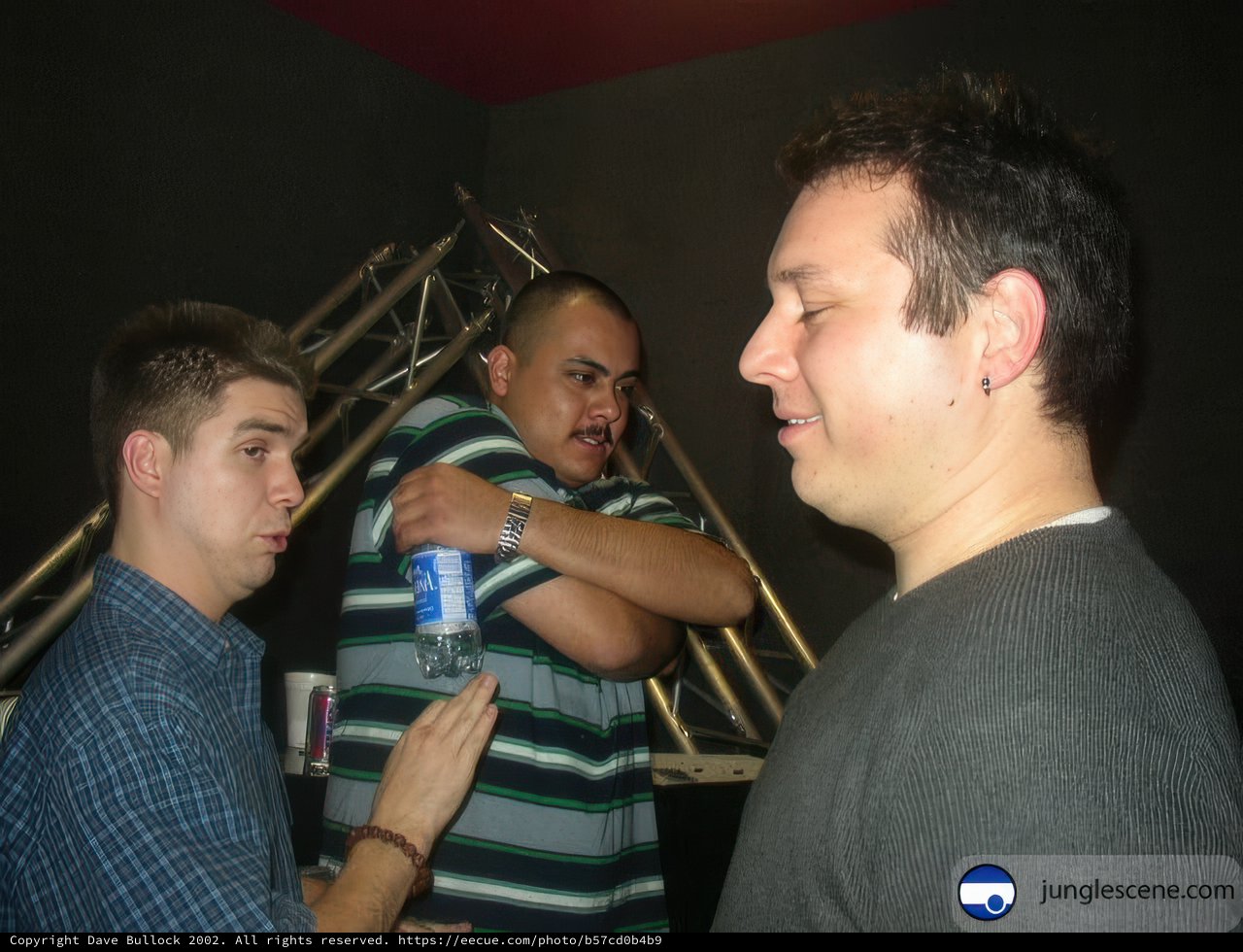 Trio of Men Enjoying a Drink in Urban Club