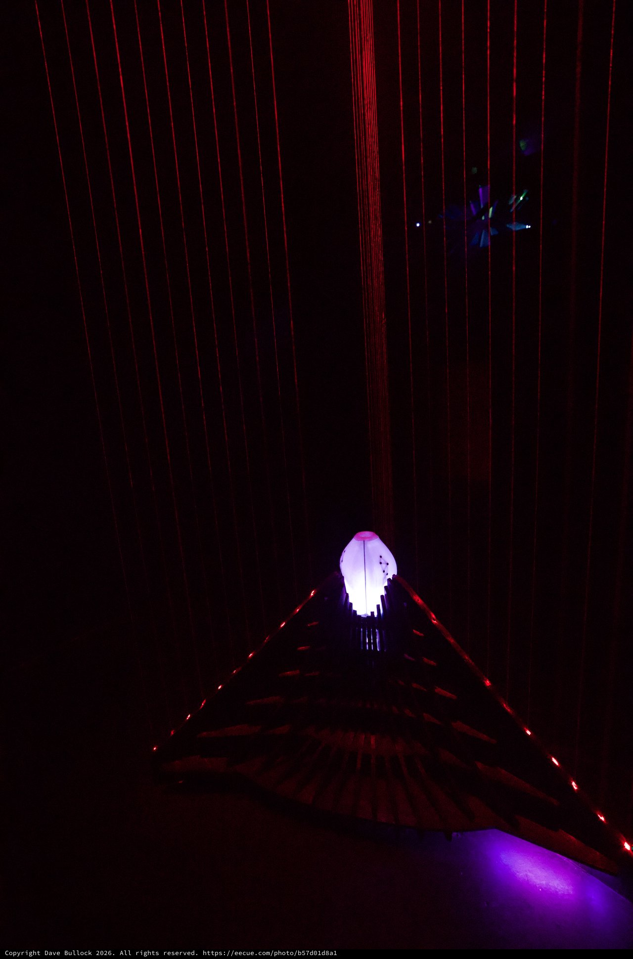 Illuminated Art Installation with Red Laser Grid