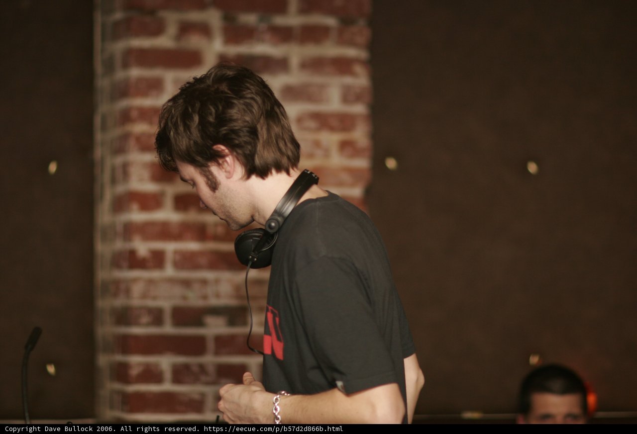 Solo Performer in Front of Brick Wall