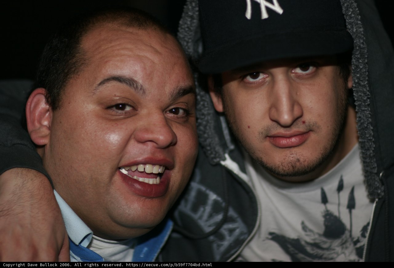 Two Men Wearing Baseball Caps