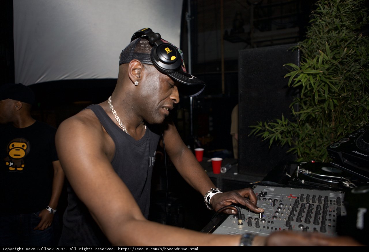 Musical Performer in Black Hat
