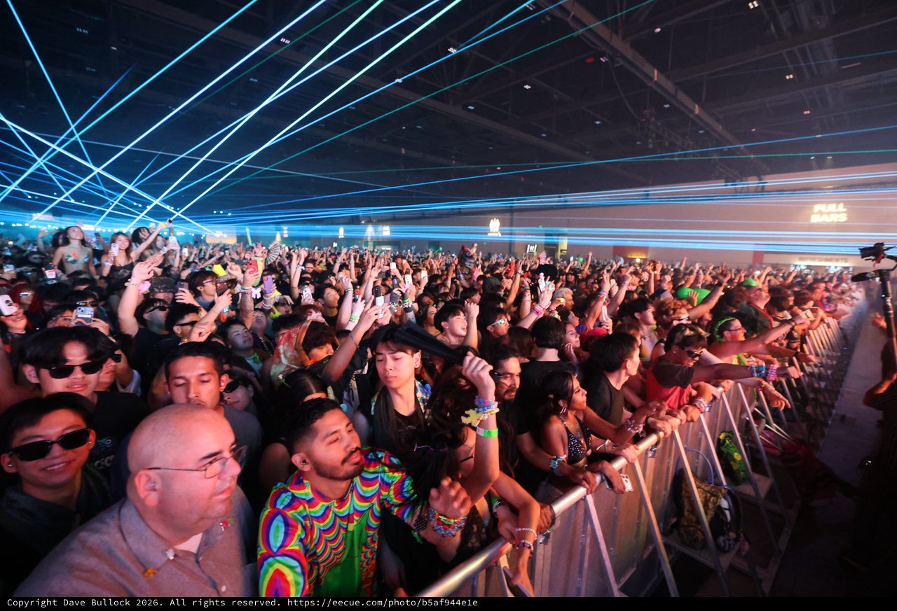 Massive Crowd Illuminated by Laser Light Show