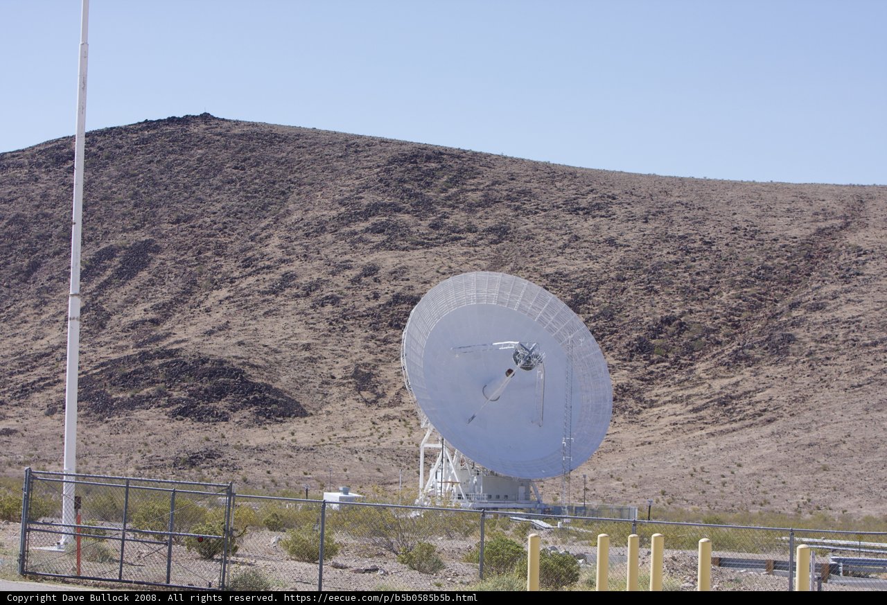 Radio Telescope Among the Rough Desert Landscape