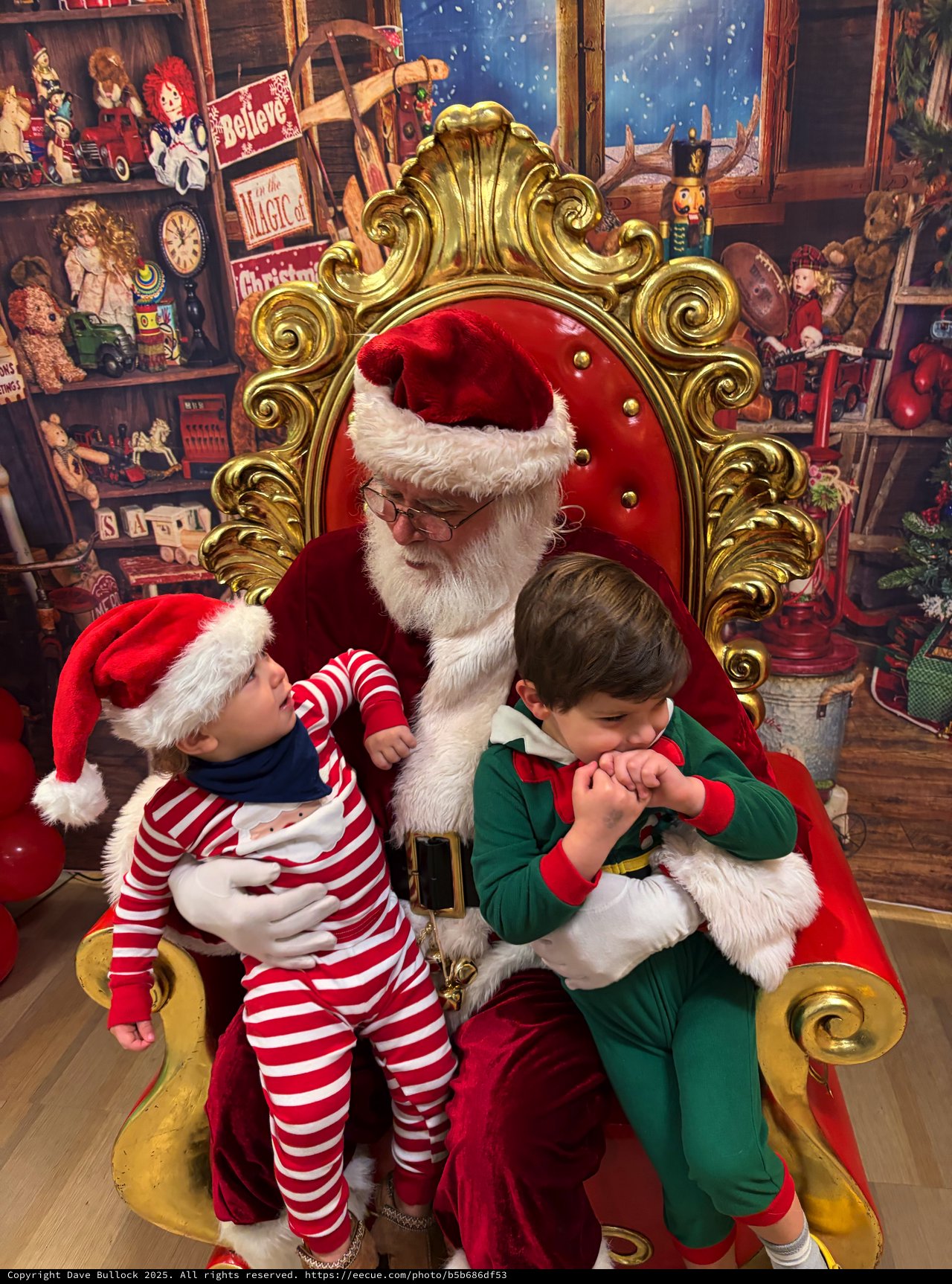 Two Children Visit Santa in His Workshop