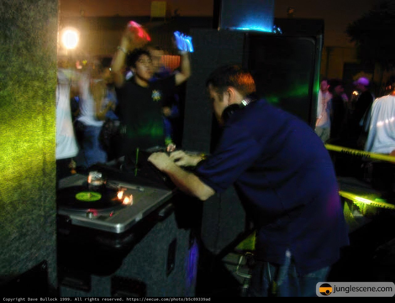 Nightclub DJ mixing beats