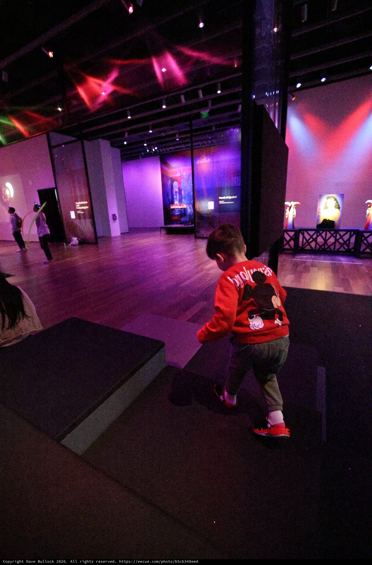 Child Exploring Modern Art Exhibition Space
