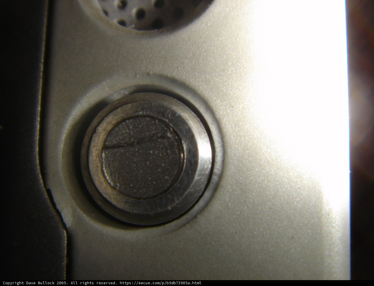 Shiny Silver Button on a High-Tech Cell Phone