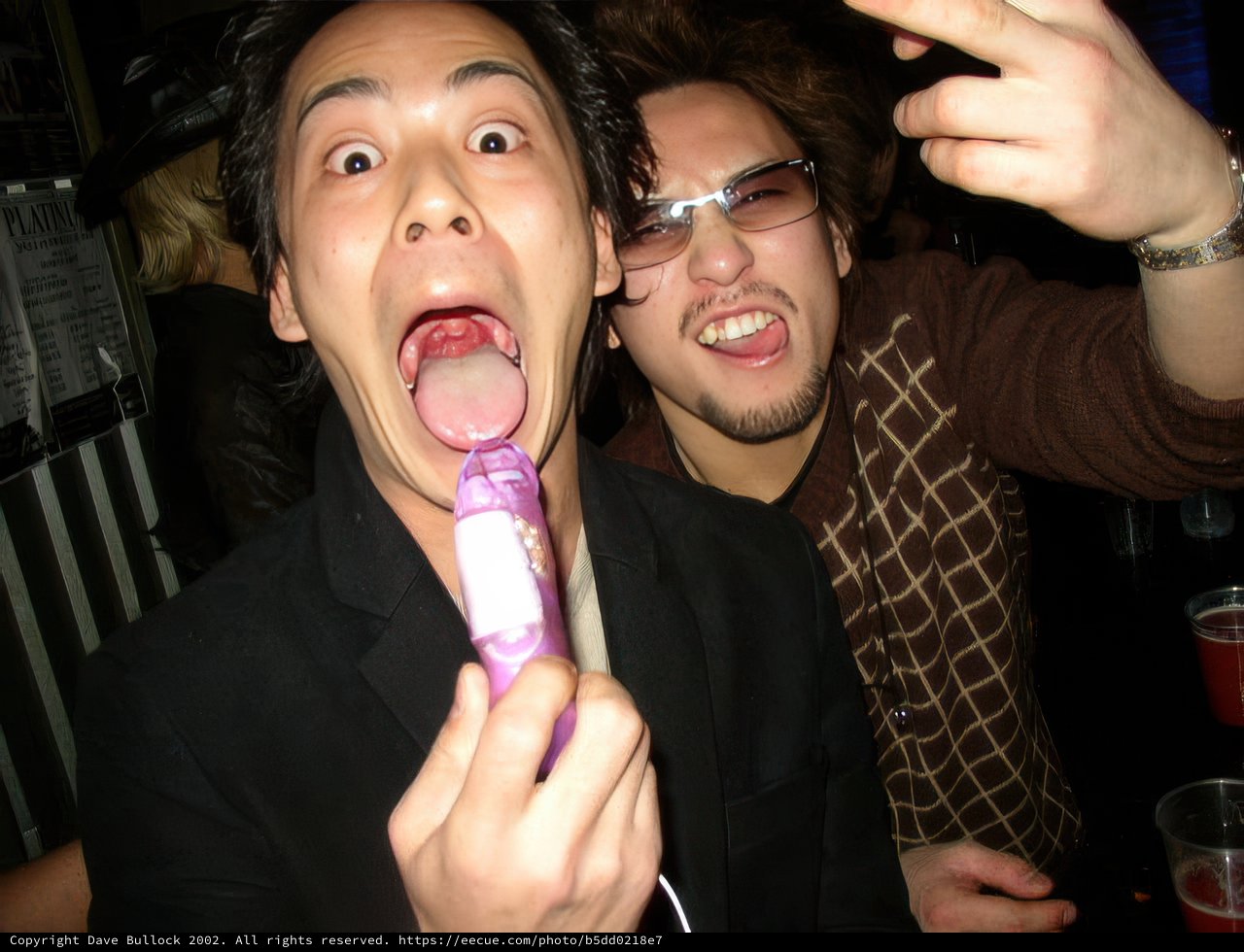 Two Men Enjoying Desserts at 2003 Nye Evo Osaka Event