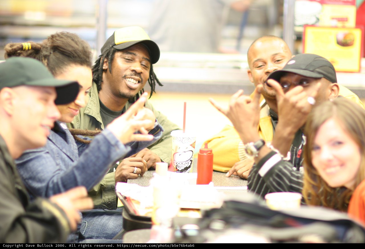 Friends Laughing Together at Fast Food Restaurant