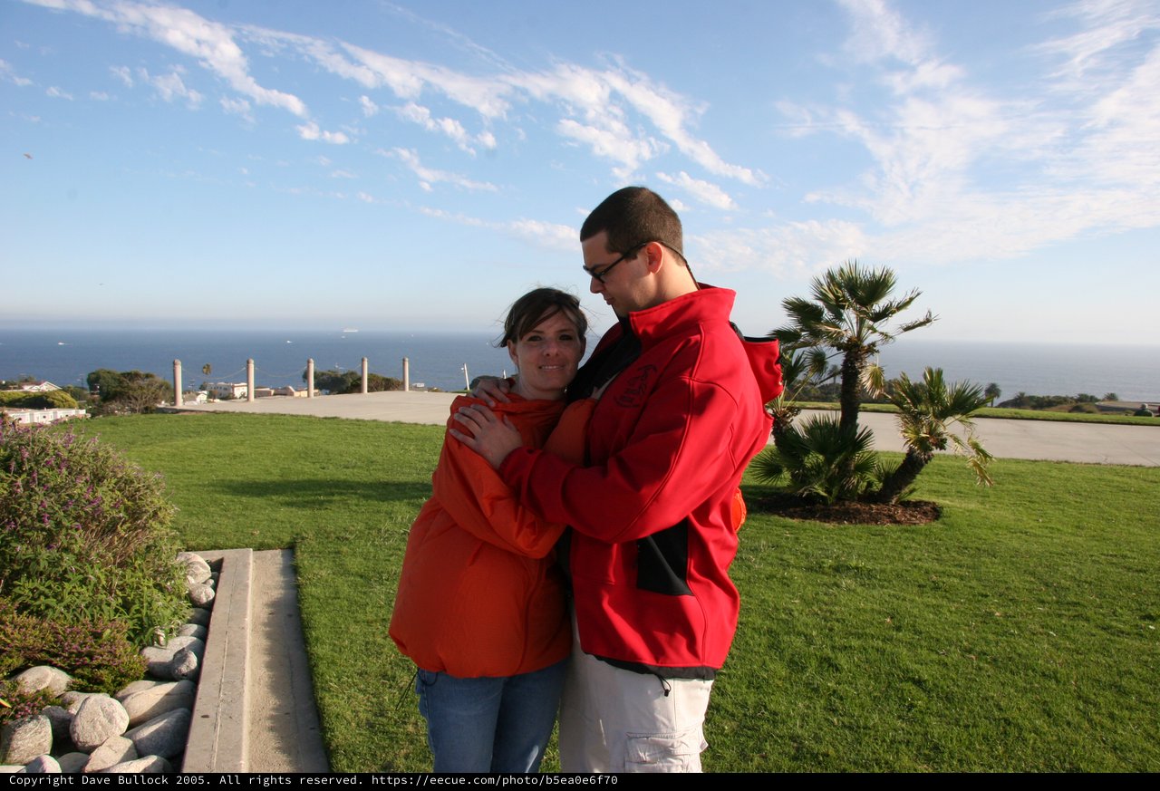 Couple Embracing Overlooking the Pacific Ocean