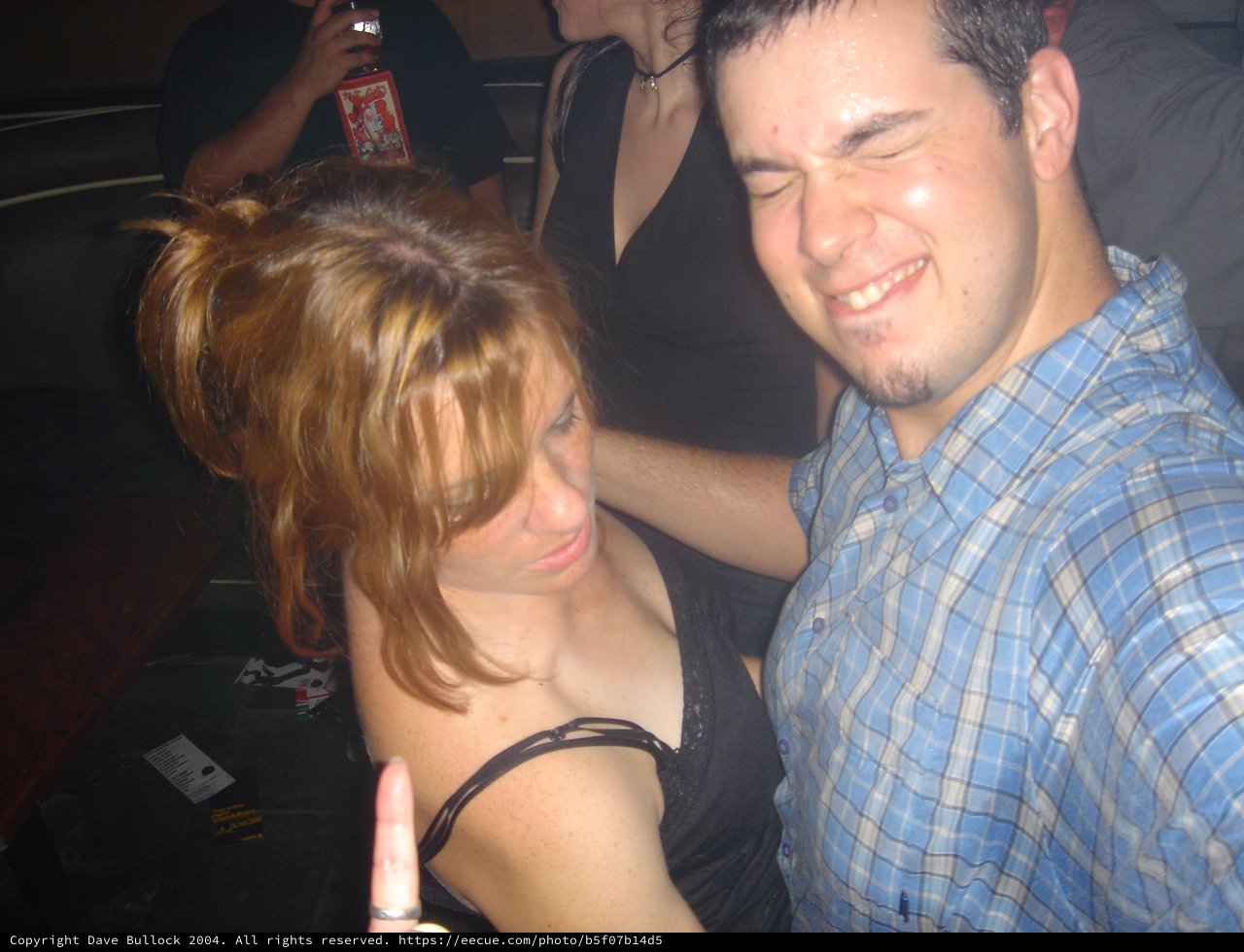 Friends Laughing Together at a Nightclub Party