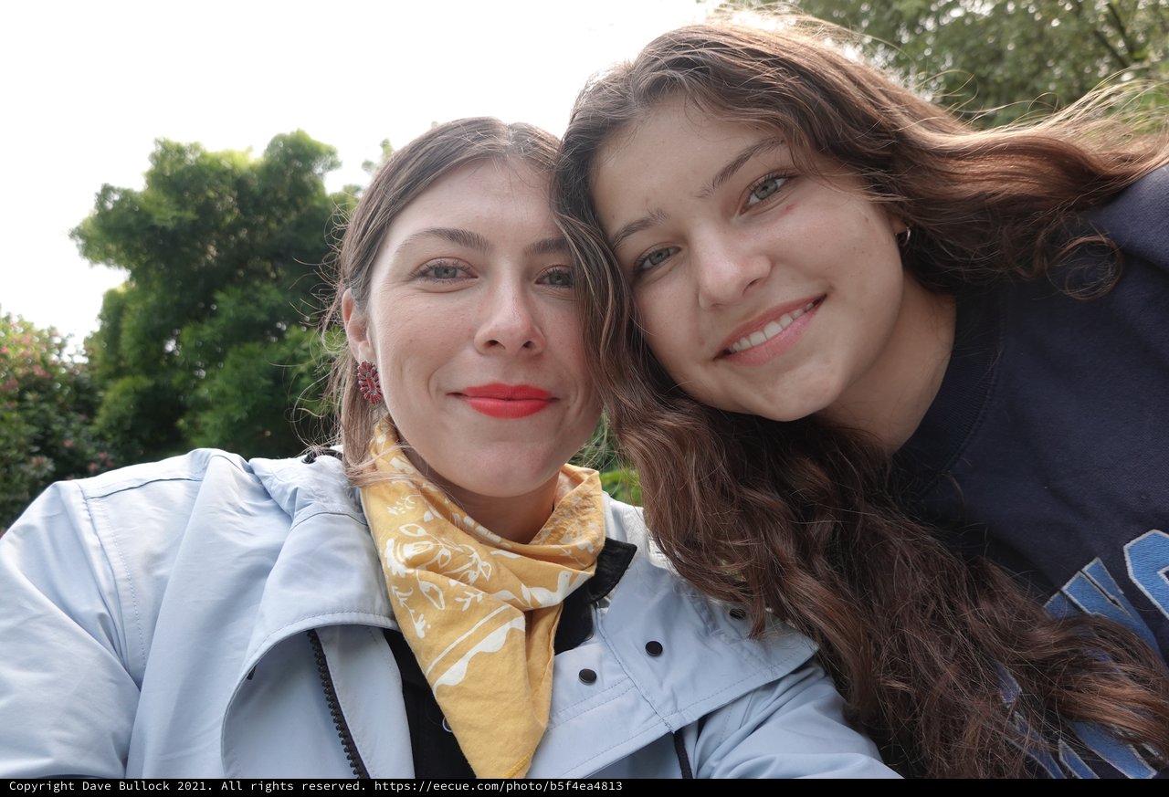 Two Friends Taking Sunny Outdoor Selfie